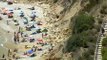 El riesgo de desprendimientos en el litoral español no frena a los bañistas