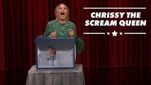 Watch Chrissy Teigen get bitten by a dinosaur