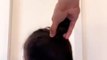 Single Dad Ties Daughter's Hair into a Bun as She Spins Around