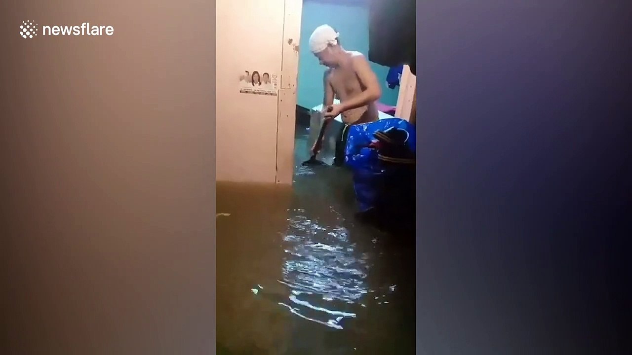 Homes submerged in water after heavy rain causes floods in the Philippines