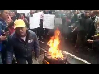 Gorkhaland agitators burning their mobiles in protest against the internet shutdown