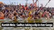 Kumbh Mela: men and women taking a dip in river Ganga