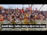 Kumbh Mela: men and women taking a dip in river Ganga