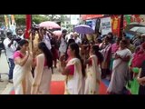 Women perform traditional Kerala dance on the road to protest against potholes