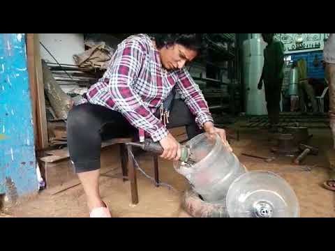Sangeetha makes a sink and container out of an empty water can