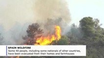 Heatwave triggers vast wildfire in northeast Spain that engulfs 13,600 acres