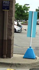 Gutsy Woman Tries to Stop Fleeing Car