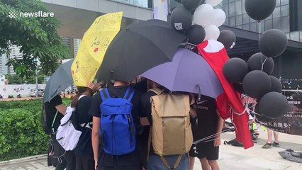 Hong Kong protesters raise black flag in front of Legislative Council