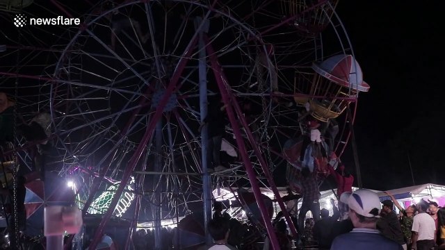 Terrifying scenes as Indonesian fairground goers become stranded on ferris wheel