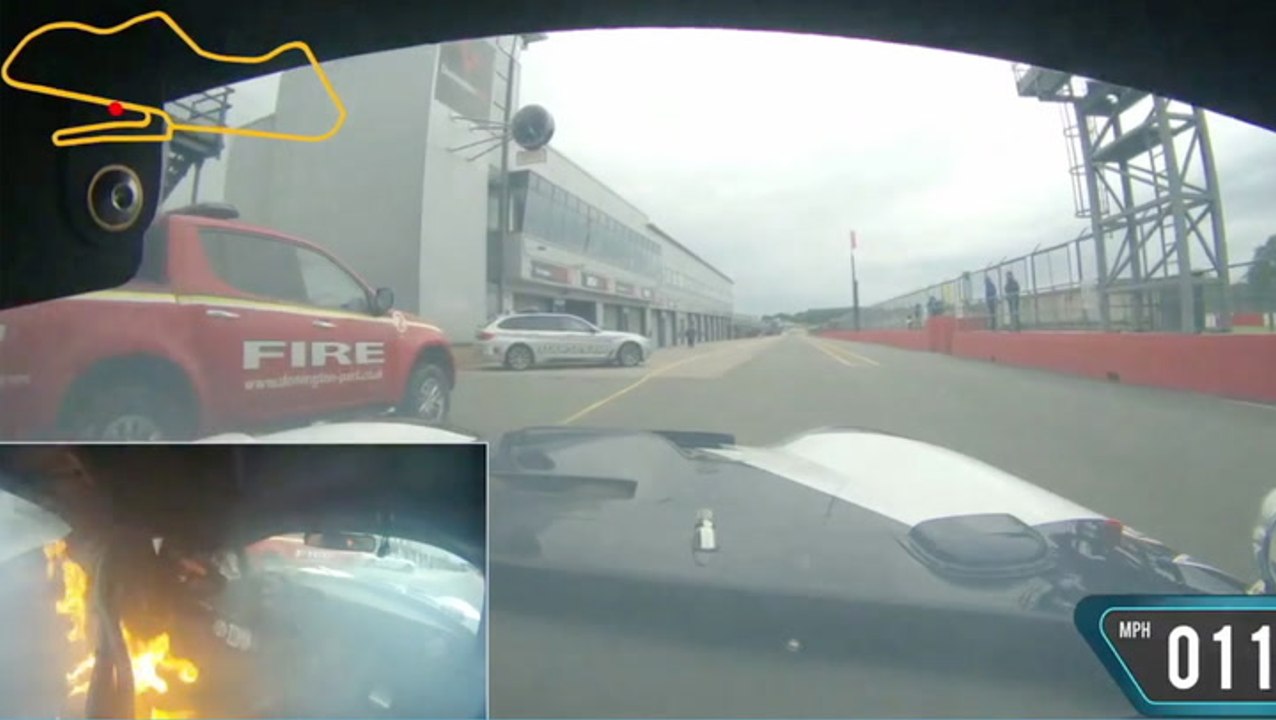 Daring Driver Keeps Racing Burning Car