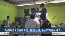 Belasan Siswa SMK Buat Patung Robot Polisi di HUT Bhayangkara