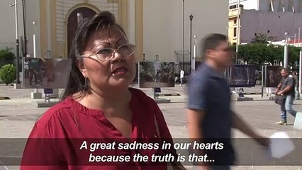 Salvadorans react after deceased migrant father, child buried