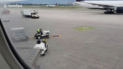 Canada airport worker caught napping on vehicle as numerous planes go past