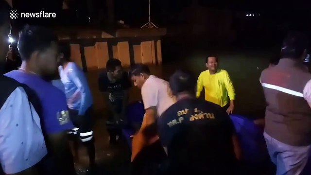 Hundreds evacuated after high tide breaks embankment flooding homes in Thailand