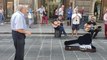 Elderly Man Dances as Street Musicians Perform in Italy