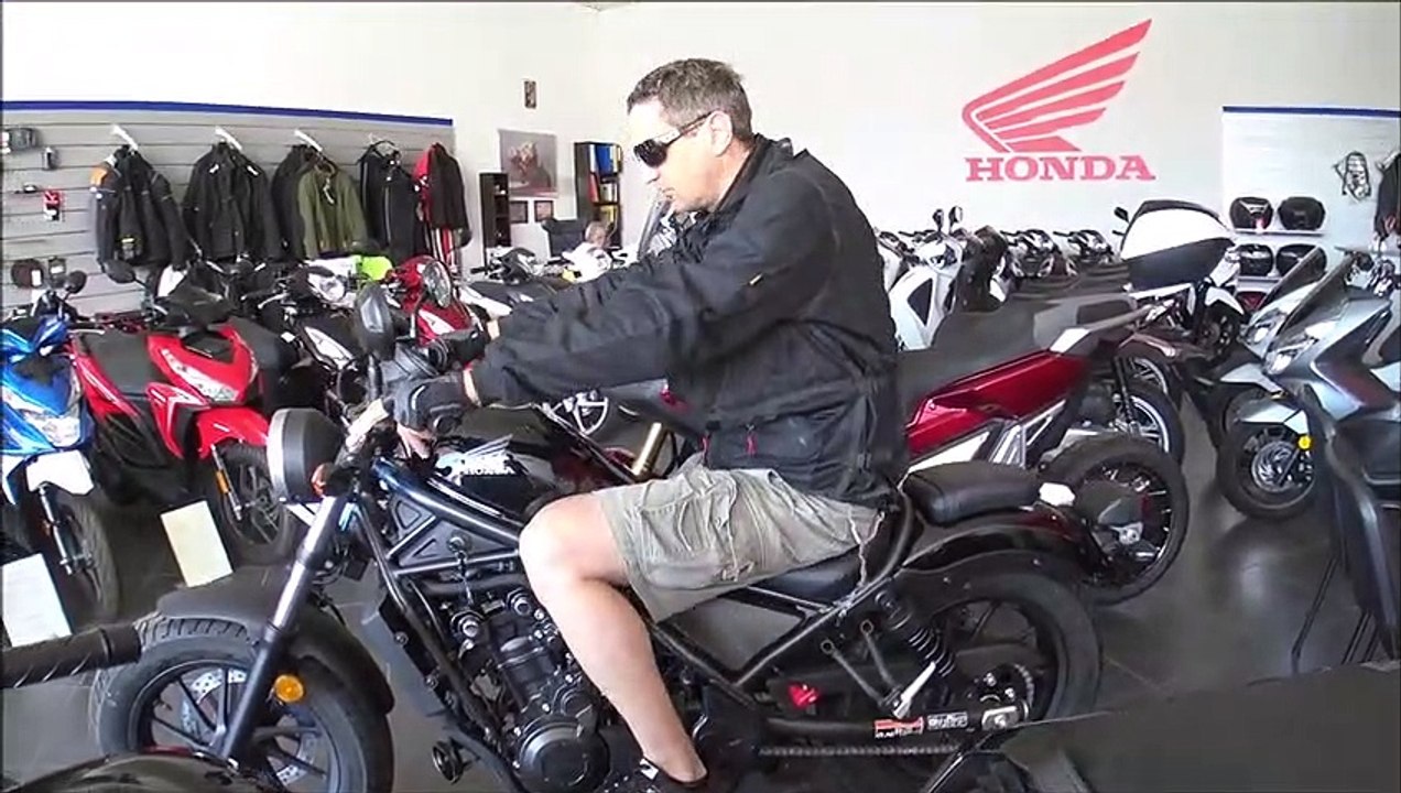 190cm man seating on HONDA REBEL 500cc cruiser 2019