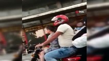 Motosiklete 5 kişi binen ailenin tehlikeye aldırış etmeden yaptığı yolculuk kamerada