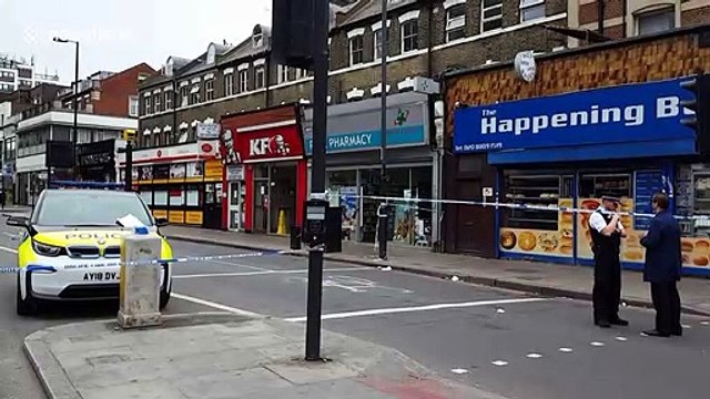 London police cordon off scene where one man was shot and another stabbed in Finsbury Park