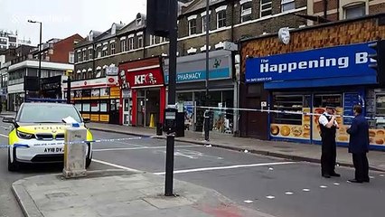 London police cordon off scene where one man was shot and another stabbed in Finsbury Park