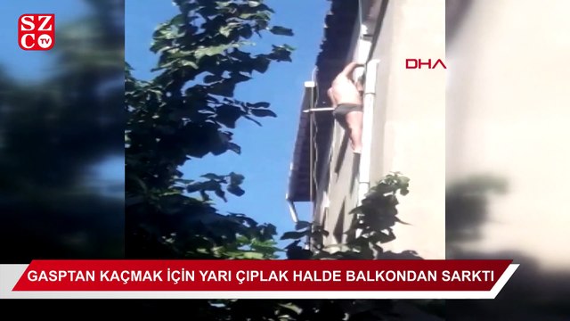 Gasptan kaçan kişi, yarı çıplak halde beşinci kattaki dairenin balkonundan sarkarak yardım bekledi.