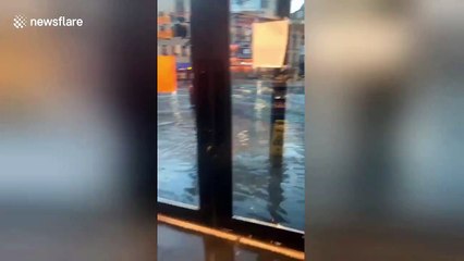 Shocking moment ice machine washed away on flooded New Orleans street