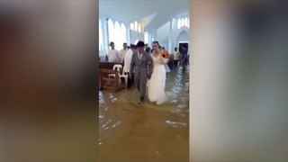 For wetter or worse: Philippine bride defies storm