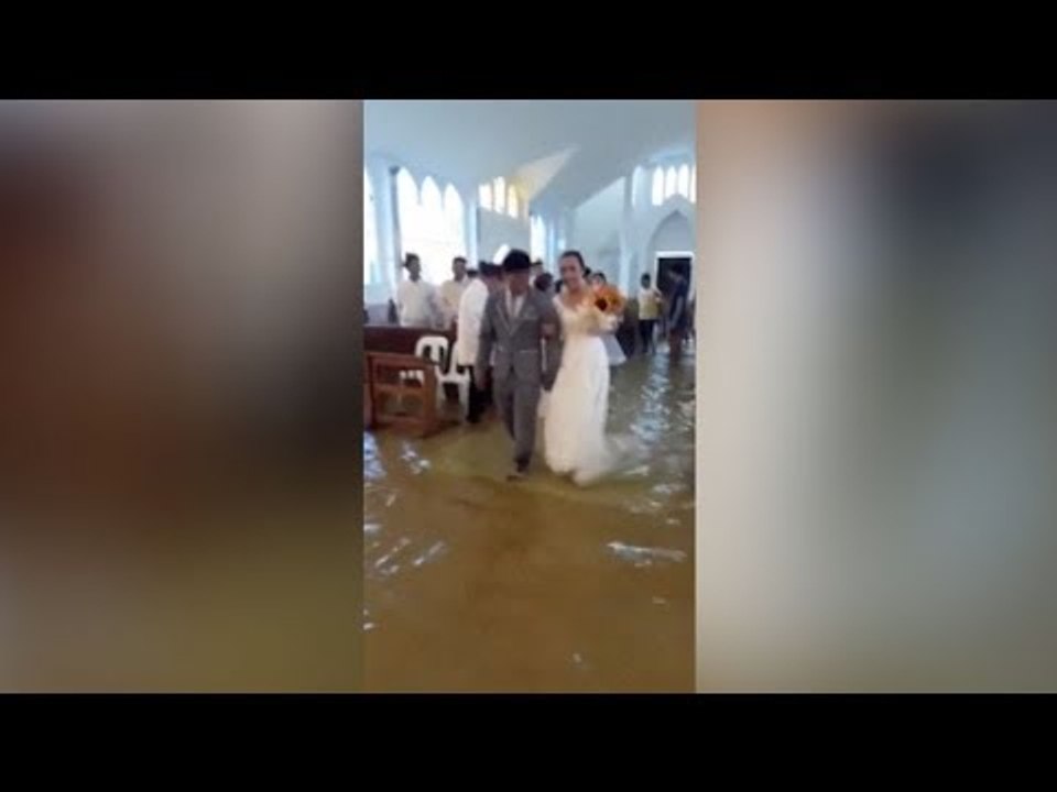 For wetter or worse: Philippine bride defies storm
