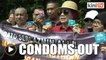 Pro-Najib NGO members bring condoms to protest Azmin outside Parliament
