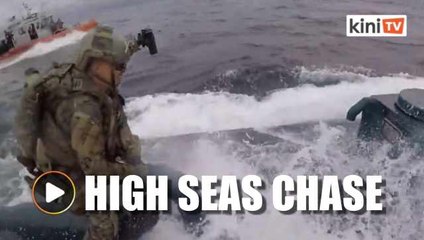 US Coast Guard crew leaps onto moving 'narco-sub'