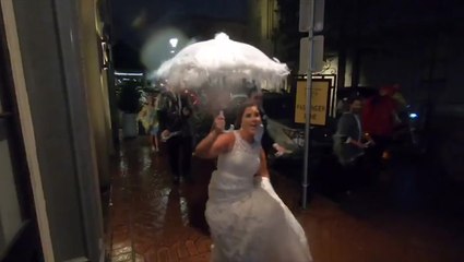 Wedding parade continues as planned even through Barry's rainfall