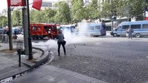 French riot police use tear gas to disperse Bastille Day protesters