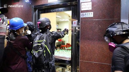 Hong Kong protesters destroy property they believe belong to triad gangsters