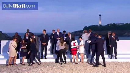 World leaders exchange greetings as they arrive for G7 dinner