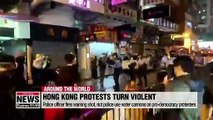 Hong Kong police fire live round warning shot and use water cannon on protesters