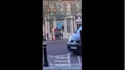 Woman uses phone box as toilet