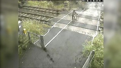 Cyclist in near-miss at level crossing