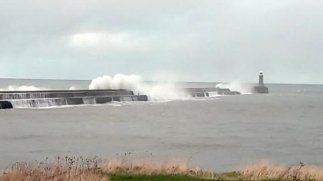 Waves crash over Tynemouth pier