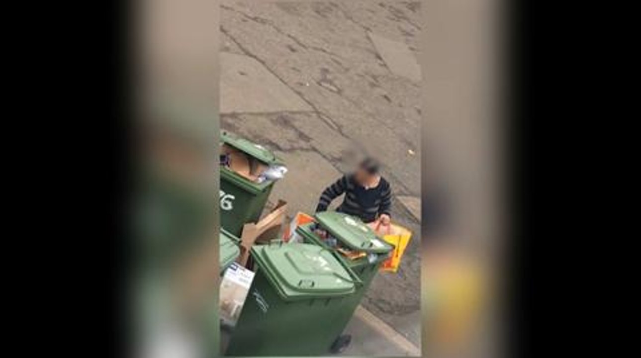 Women going through people's bins