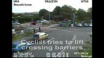 VIDEO: Warning to road users after CCTV spots cyclist getting stuck behind level crossing gates in West Sussex