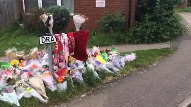 Flower tributes outside Drayton Walk in St Davids