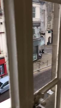 A video shows a pedestrian dodging out the way of a getaway car escaping an armed robbery in Northampton.