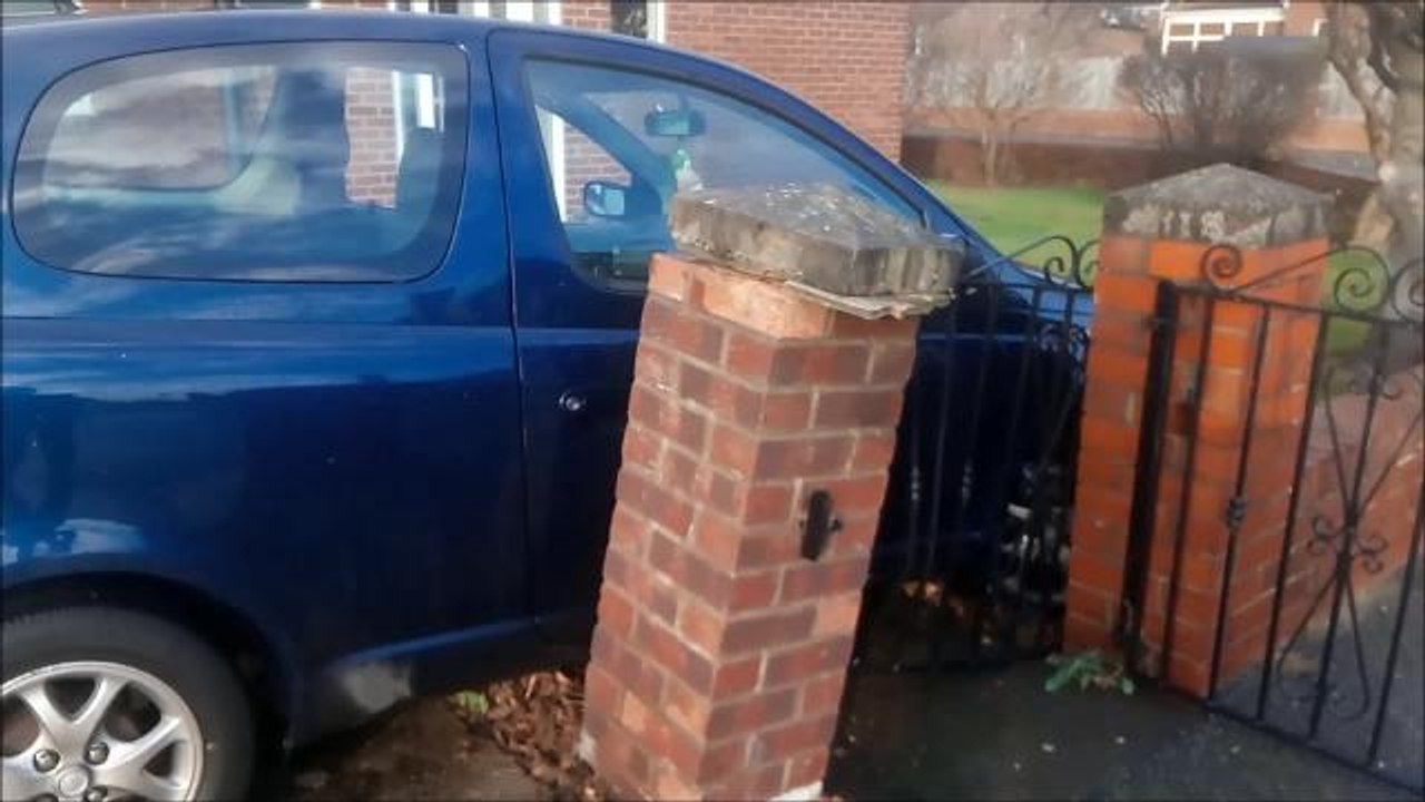 Car crashes into garden wall