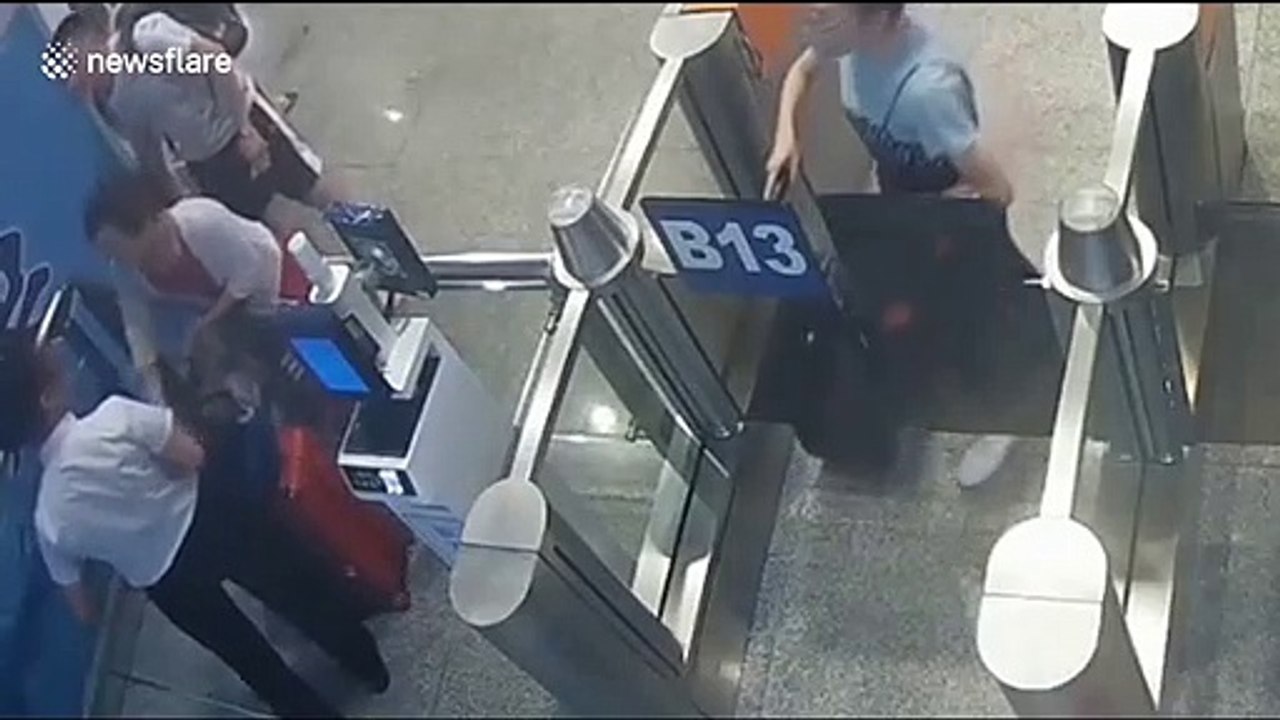 Chinese woman uses foot to prevent train from departing after arriving late to the station