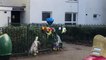Seven bunches of flowers and a blue heart-shaped balloon have been left by the railings at the scene of a Northampton murder.