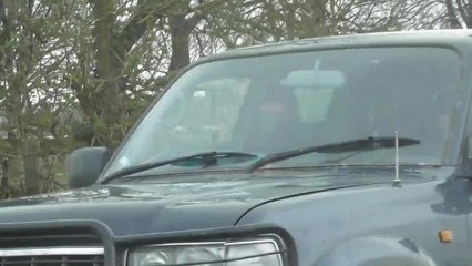 SWNS - Video of frightening moment animal activists were repeatedly RAMMED by a 4x4 while driving to a hunt