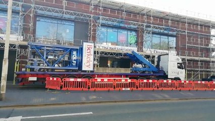 The mobile crane is building a tower crane