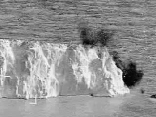 HMS Duncan fires a gun