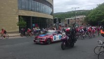 The Tour de Yorkshire riders snake past the Broad Street Plaza in Halifax.