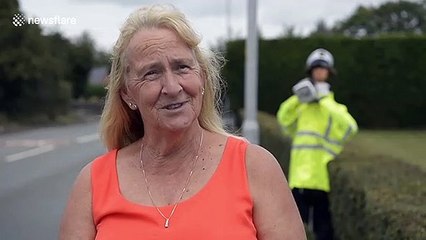 Bogus bobby: A scarecrow cop made of straw slows speeding drivers in England