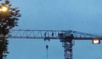 Young people dice with death on 100ft crane